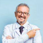 A doctor pointing his finger to his left, the viewer's right